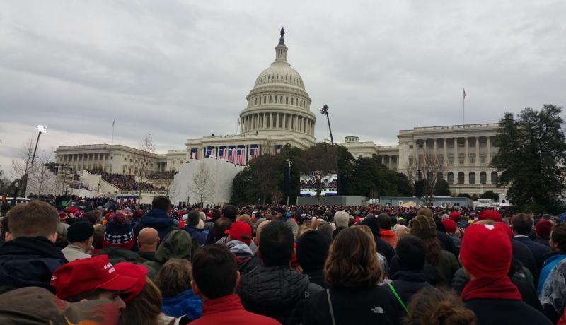 A crowd stands watch at the US Capitol building on Innaguration day in 2017.