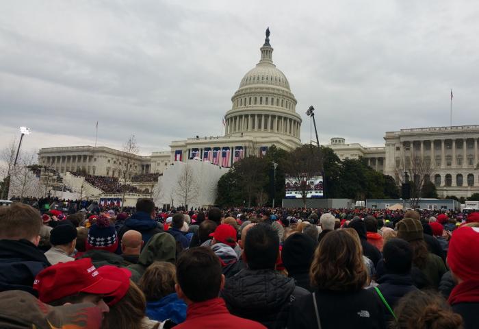 A crowd stands watch at the US Capitol building on Innaguration day in 2017.