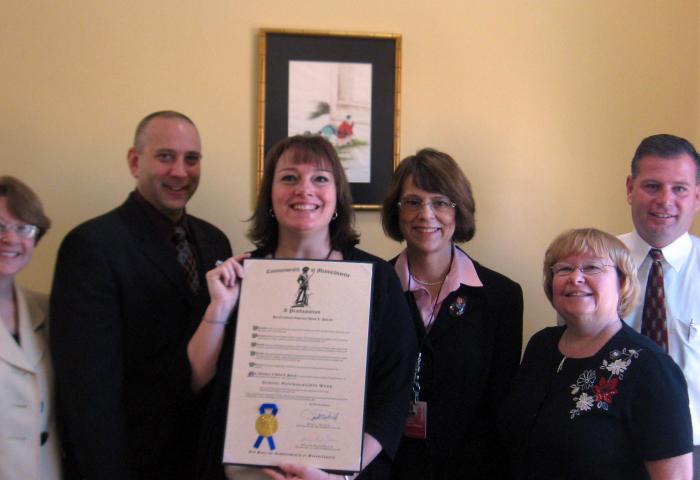 people posing with award