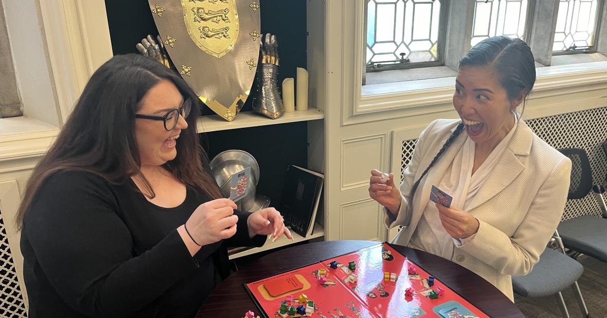 two women playing boardgame