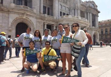 students on an international trip posing in front of a cultural center