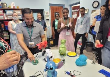 teachers working robots and toys