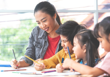 female teacher w young students