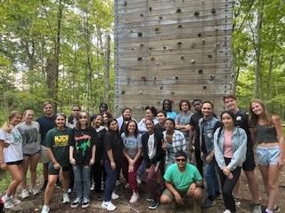 TRIO GROUP POSE AT WALL CLIMBING OUTING