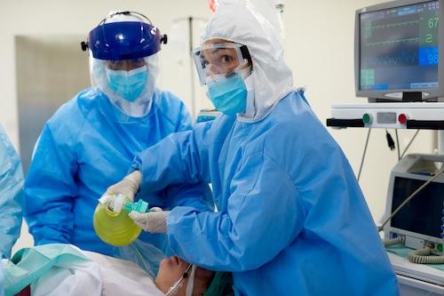 medical professionals in scrubs with patient