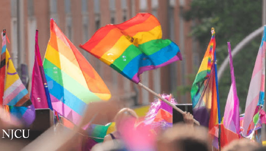 pride flags above a crowd